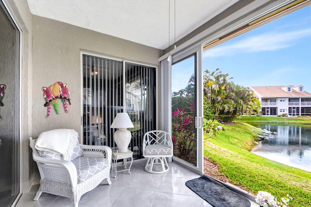 sunroom with a water view