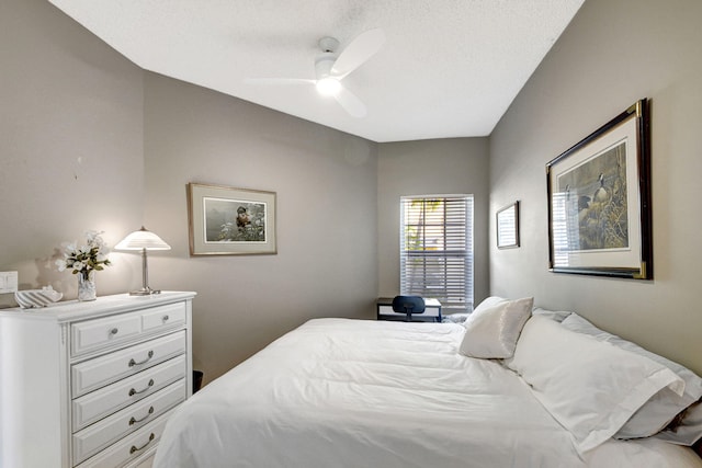 bedroom with a textured ceiling and ceiling fan