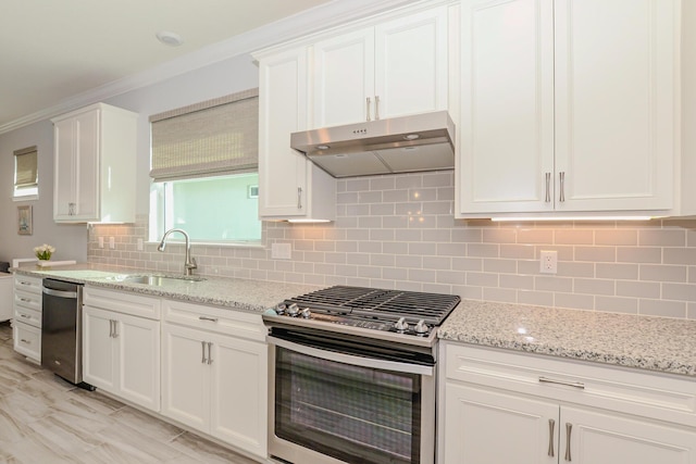 kitchen with white cabinets, decorative backsplash, sink, and appliances with stainless steel finishes