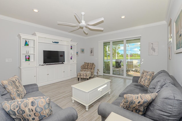 living room with ceiling fan, light wood-type flooring, and ornamental molding