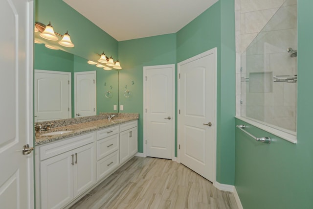 bathroom featuring wood-type flooring and vanity