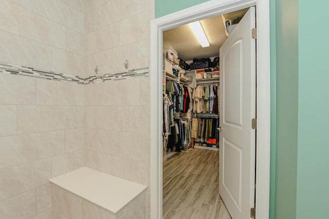 bathroom with hardwood / wood-style floors