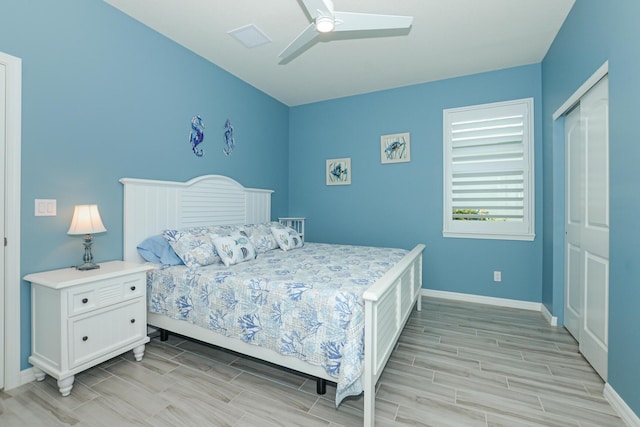 bedroom with ceiling fan and a closet