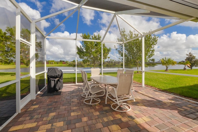 unfurnished sunroom featuring a water view