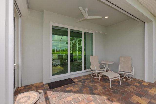 view of patio featuring ceiling fan