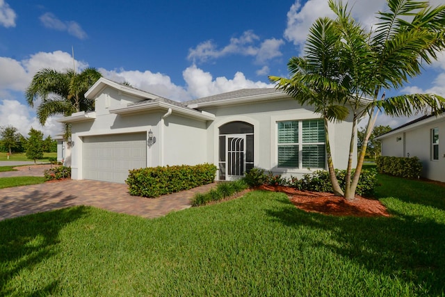 view of front facade with a front lawn and a garage