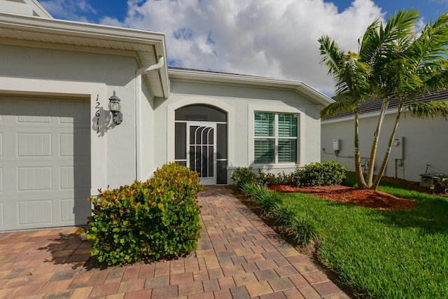 doorway to property featuring a garage