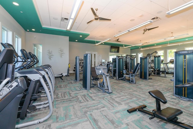 gym with ceiling fan and carpet floors