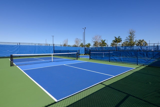 view of tennis court with basketball court