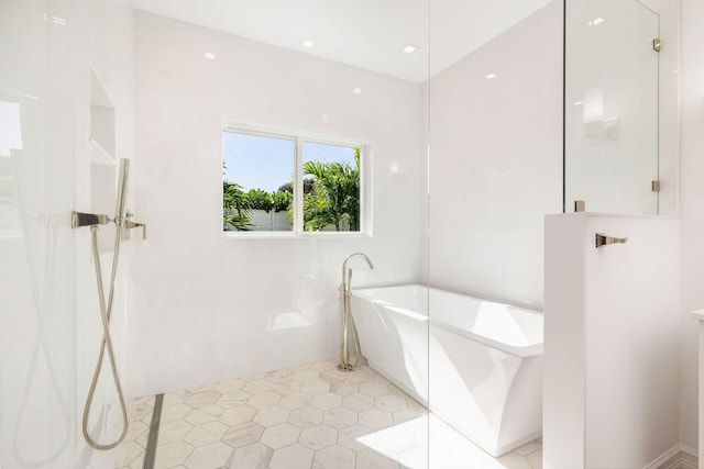 bathroom featuring tile patterned floors and a bathing tub