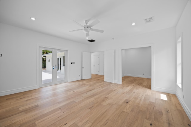 unfurnished living room featuring light hardwood / wood-style floors, ceiling fan, and french doors