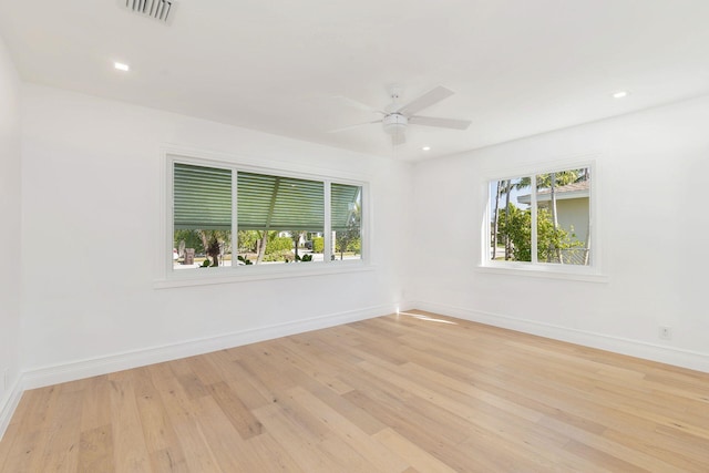 empty room featuring ceiling fan and light wood-type flooring