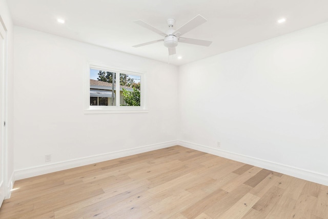 empty room featuring ceiling fan and light hardwood / wood-style floors