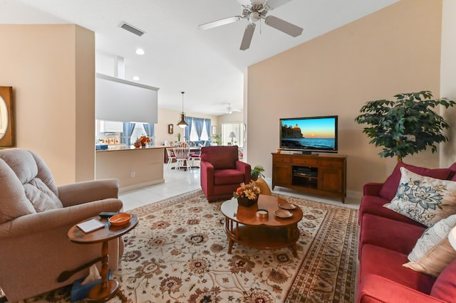 tiled living room featuring ceiling fan