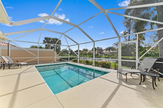 view of pool with a water view, a patio, and a lanai