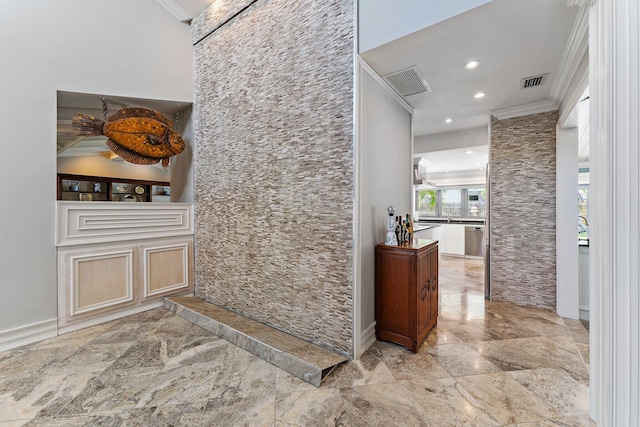 interior space with crown molding