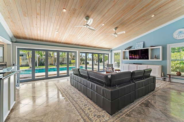 living room with plenty of natural light, ceiling fan, and wood ceiling