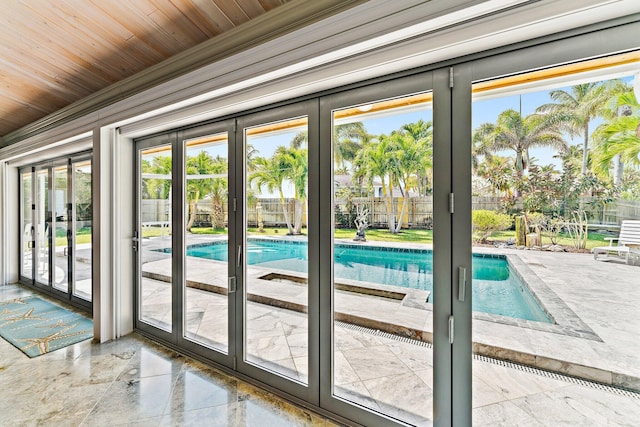 doorway to outside featuring wooden ceiling