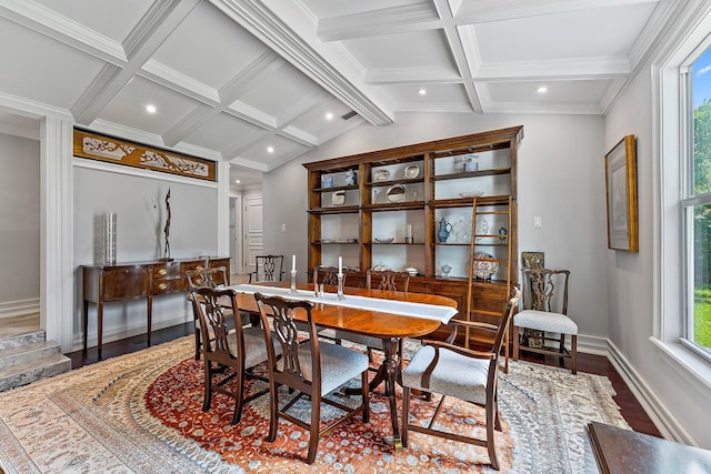 dining space with wood-type flooring, vaulted ceiling with beams, and ornamental molding