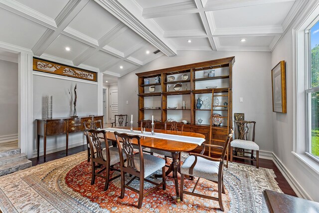 dining room with vaulted ceiling with beams, dark hardwood / wood-style floors, and crown molding