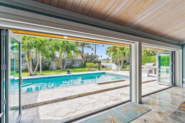 view of swimming pool with a patio area