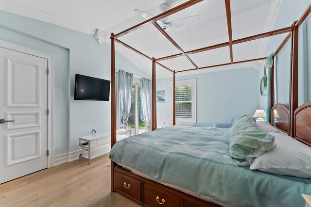 bedroom with ornamental molding, light hardwood / wood-style flooring, and ceiling fan