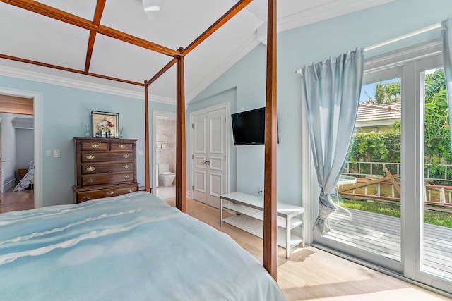 bedroom featuring vaulted ceiling, access to outside, crown molding, ensuite bath, and a closet