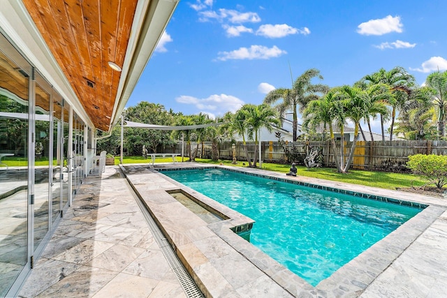 view of pool featuring a jacuzzi and a patio