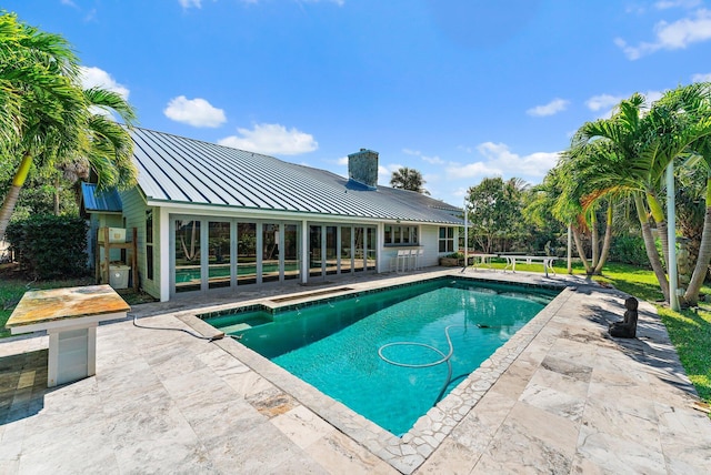 view of swimming pool featuring a patio area