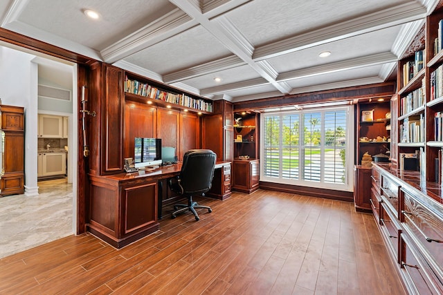 office area with ornamental molding, hardwood / wood-style floors, beamed ceiling, and coffered ceiling