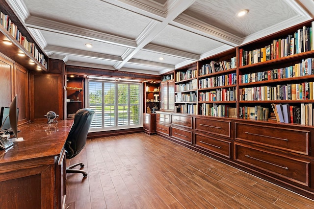 office area featuring crown molding, beam ceiling, dark hardwood / wood-style floors, coffered ceiling, and built in shelves