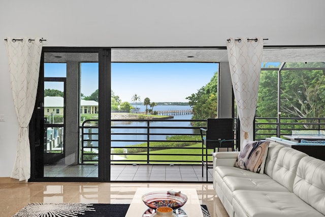 entryway featuring plenty of natural light and a water view