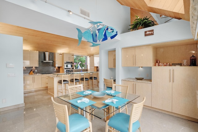 dining space featuring wooden ceiling