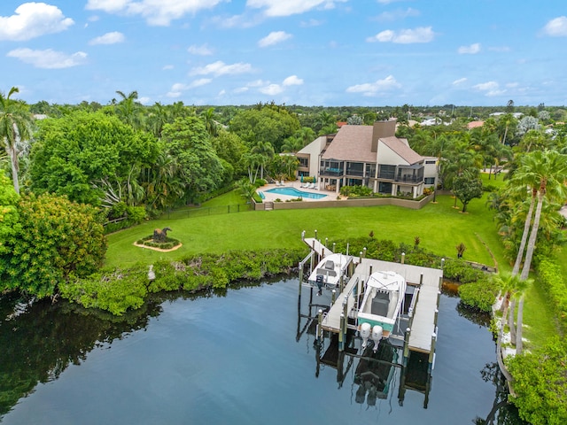 view of dock featuring a water view and a lawn