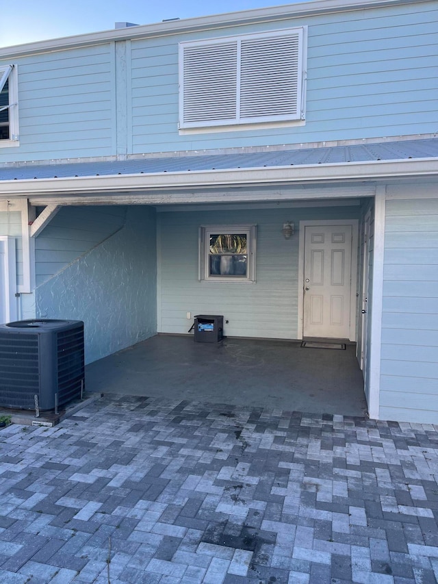 doorway to property with central AC