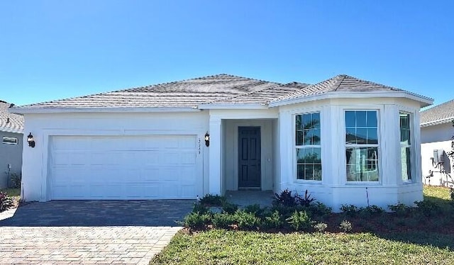 view of front of property with a garage