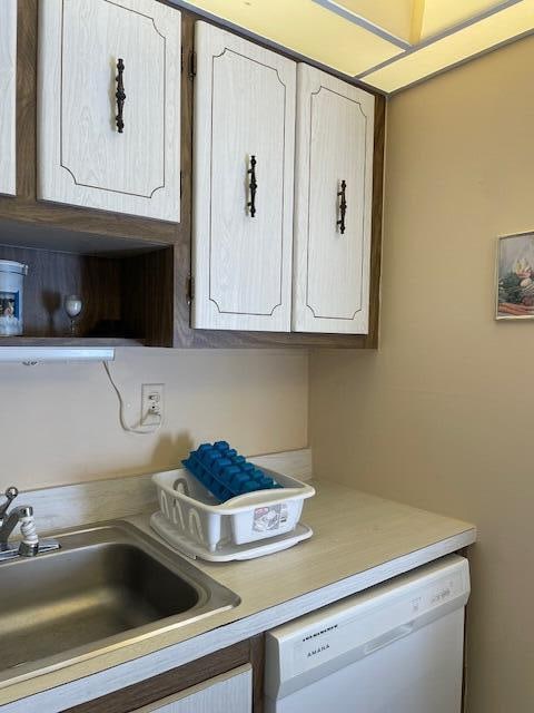 kitchen featuring sink and white dishwasher