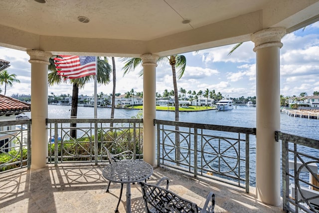 balcony featuring a water view