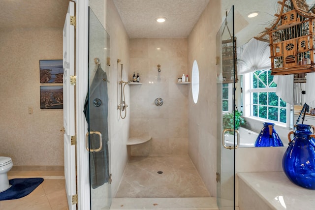 bathroom with tile patterned flooring, a textured ceiling, toilet, and an enclosed shower