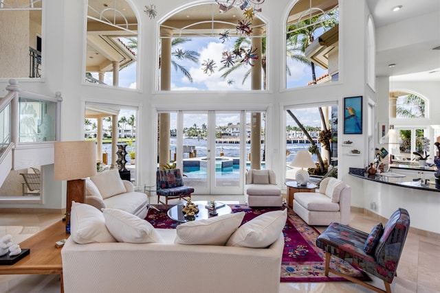 tiled living room with a towering ceiling