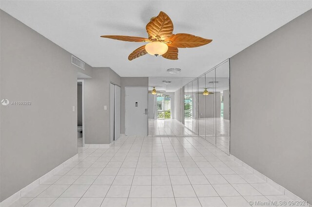 interior space featuring ceiling fan