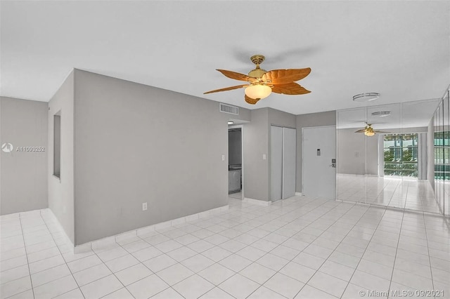 unfurnished room featuring light tile patterned floors and ceiling fan