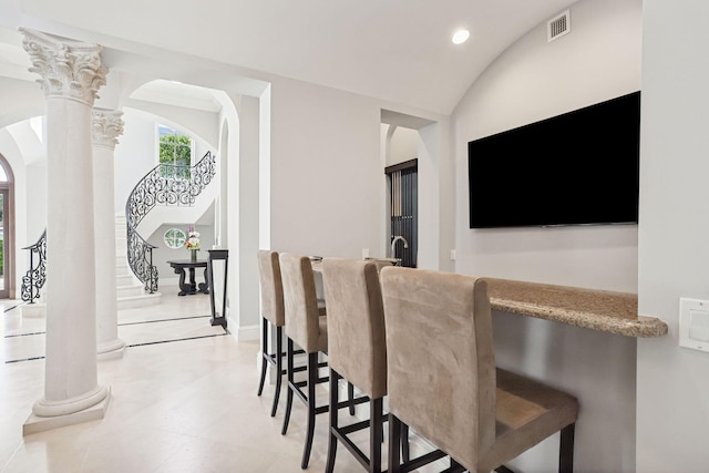 bar with vaulted ceiling and ornate columns