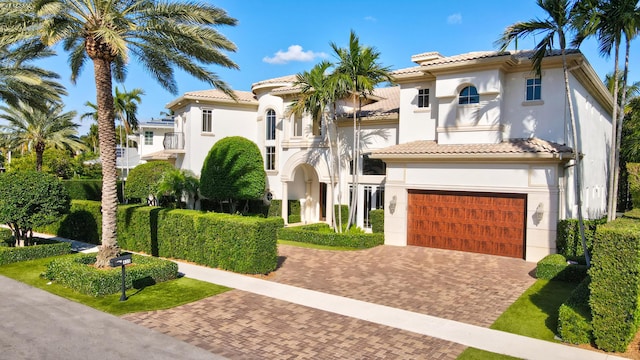 mediterranean / spanish-style home featuring a garage