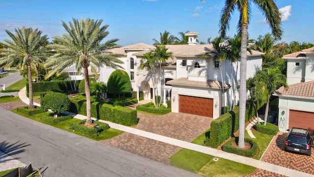 mediterranean / spanish house with a garage