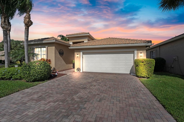 mediterranean / spanish-style home featuring a garage