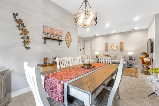 tiled dining area with a notable chandelier