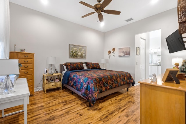 bedroom with hardwood / wood-style flooring and ceiling fan