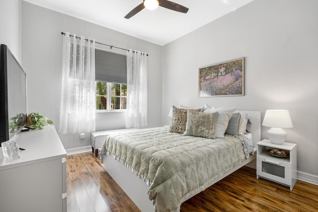 bedroom featuring ceiling fan and dark hardwood / wood-style floors