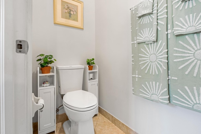 bathroom featuring toilet and tile patterned floors